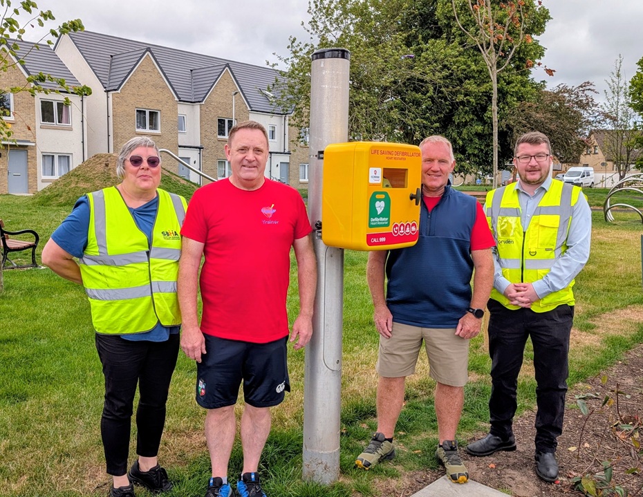 Cruden and SBHA help deliver defibrillator for Borders community