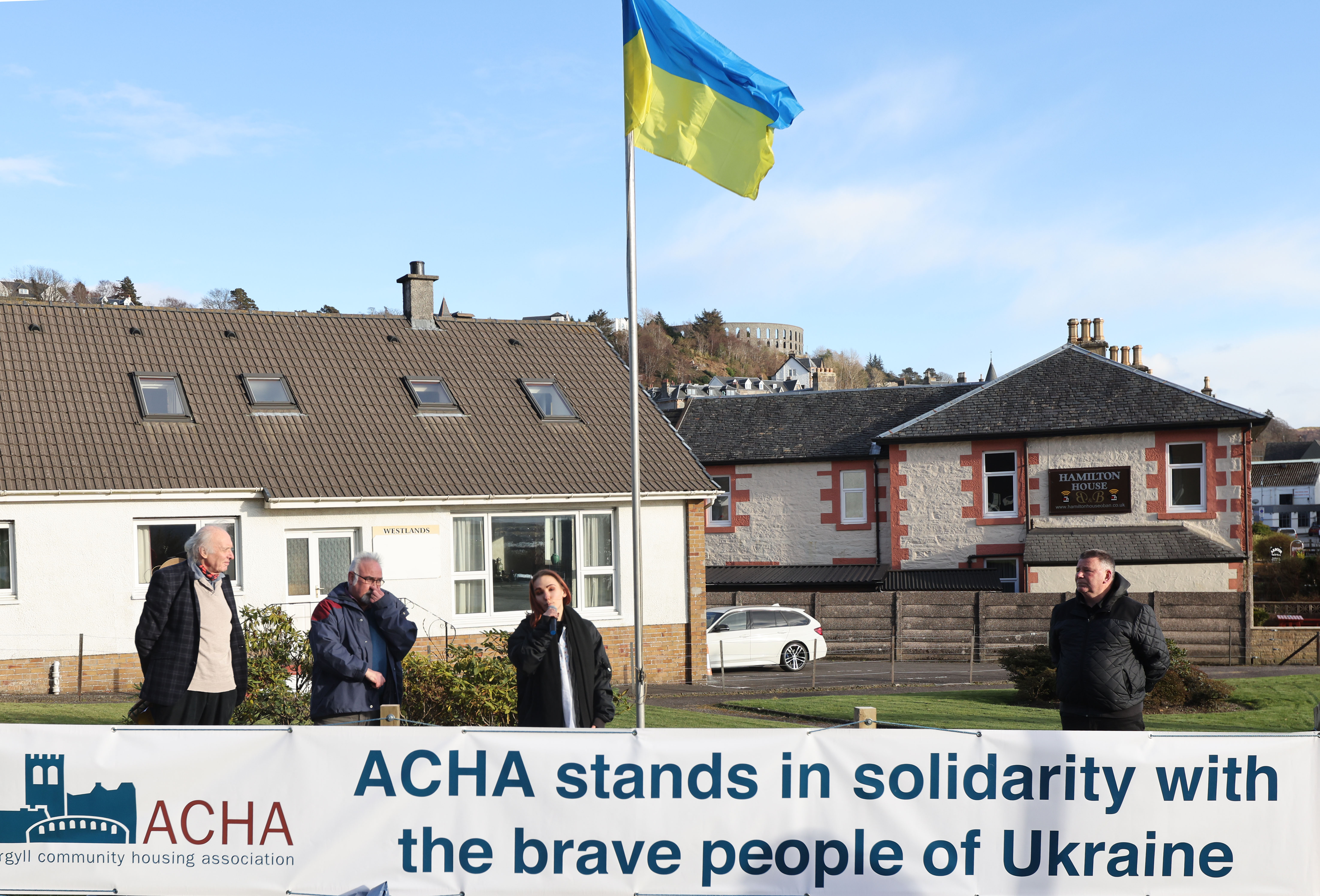 ACHA raises a banner and flag in solidarity with the people of Ukraine