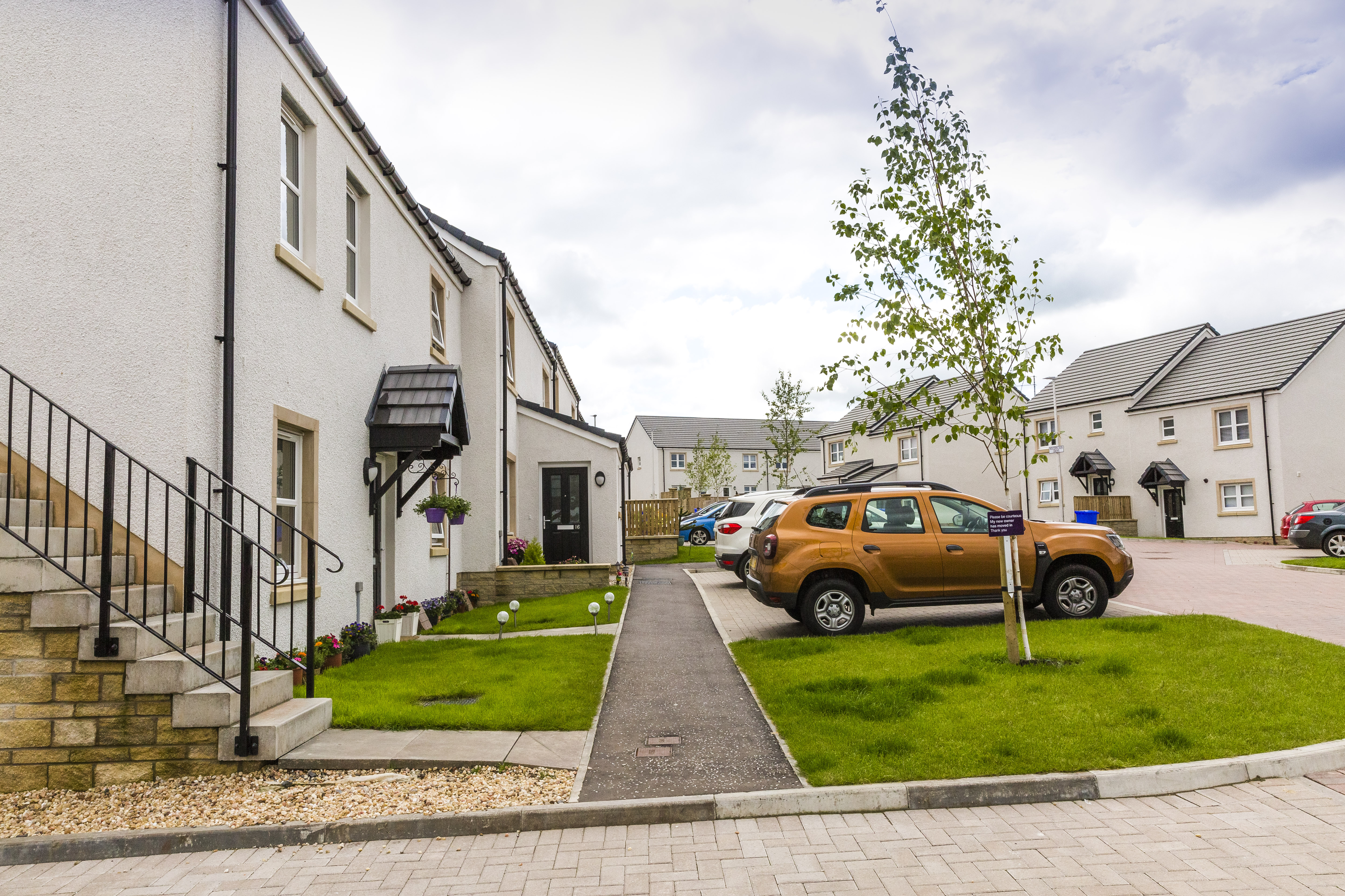 Smiles all around at Symington’s first affordable housing development