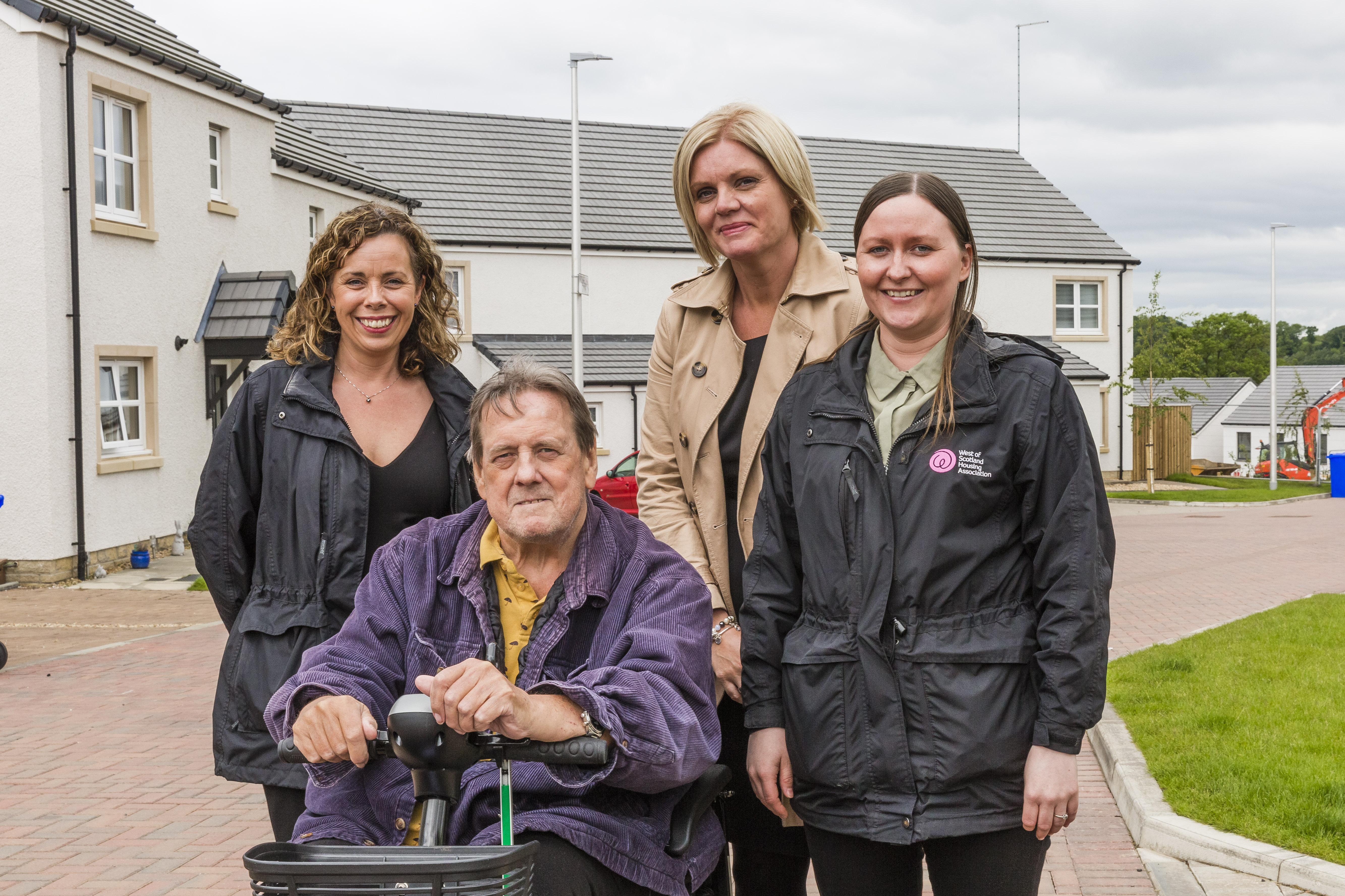 Smiles all around at Symington’s first affordable housing development